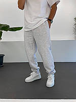 Мужские теплые спортивные штаны светло-серые трехнитка на флисе свободный крой M