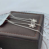 Сережки протяжки срібні з підвісками сніжинками без каменів