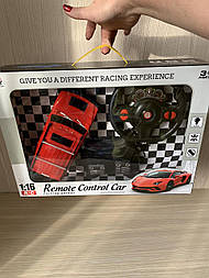 Машина червона на радіокеруванні задньоприводна, педалі та кермо, звук і світло Якості!