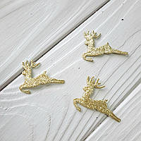 Олень у стрибку з фетру з блискітками золотий.