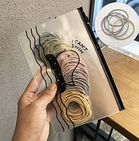 Набір резинок для волосся в пакетику на застібці. Світлий мікс