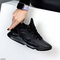 Модельные черные женские миксовые кроссовки с перфорацией на фигурной подошве