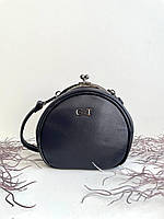 Жіноча сумка ридикюль на плече кругла, кросбоді зі шкірозамінника італійського бренду Gilda Tohetti.