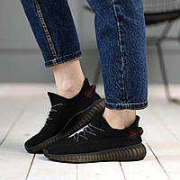 Спортивные женские кроссовки из текстиля в черном цвета с резиновой подошвой