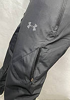Мужские тёплые спортивные штаны Under Armour черные зимние плащевка на флисе