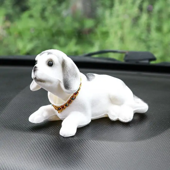 Собачка з ковючою головою на панель авто іграшка білого кольору