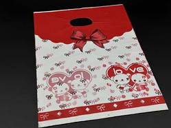 Подарункові поліетиленові пакети 25х35см "Love". Колір біло-червоний. / Подарункові поліетиленові пакети 25х35см "Love". Колір