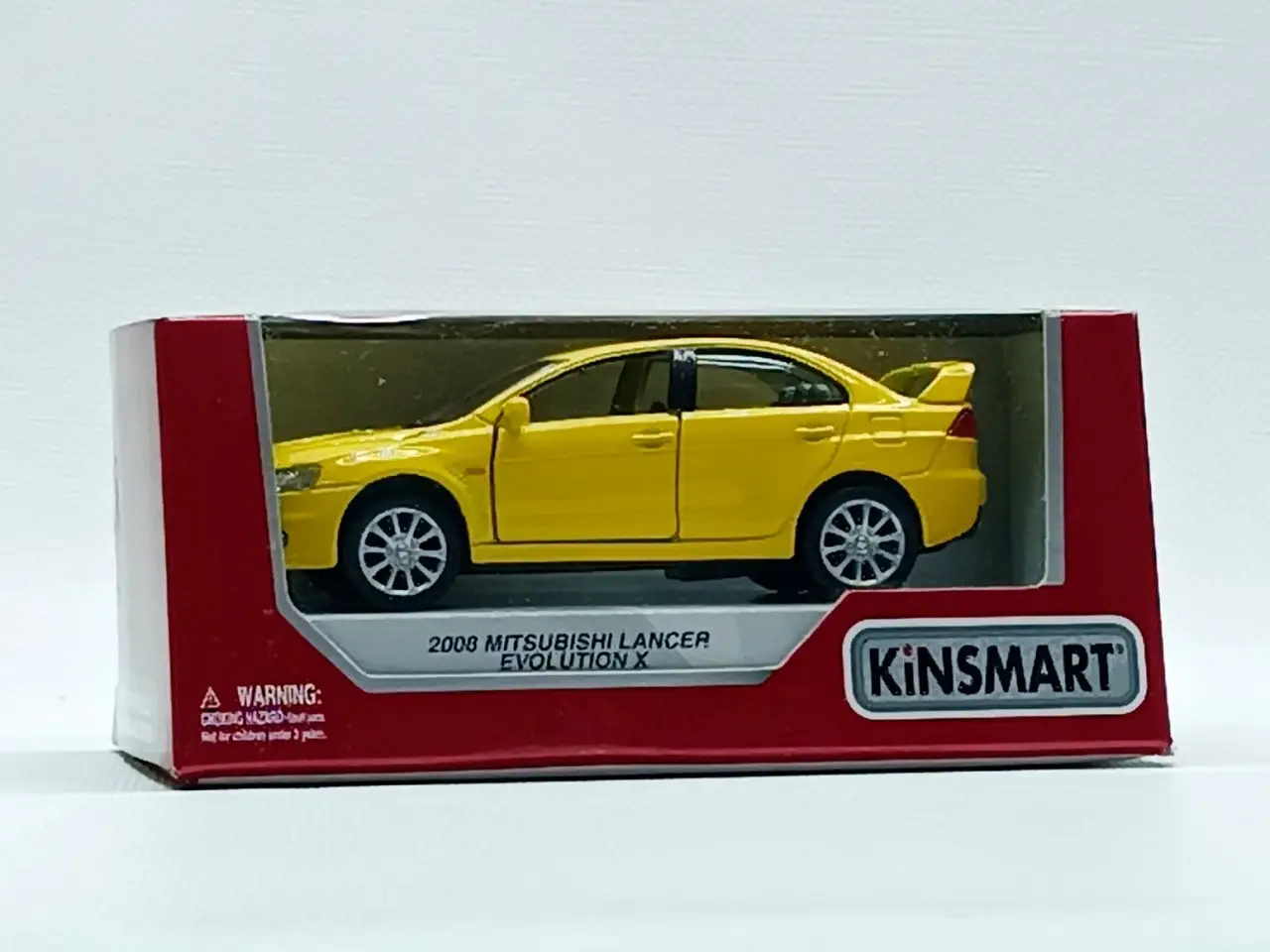 Машина kinsmart "Mitsubishi Lancer Evolution" желтая KT5329W-1 - фото 4 - id-p2076440131
