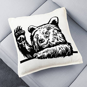 Декоративна чорно-біла подушка з ведмедем.