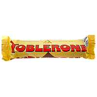 Шоколад молочний з медом та мигдальною нугою Тоблероне Toblerone 35g 24шт/пач (Код: 00-00015605)