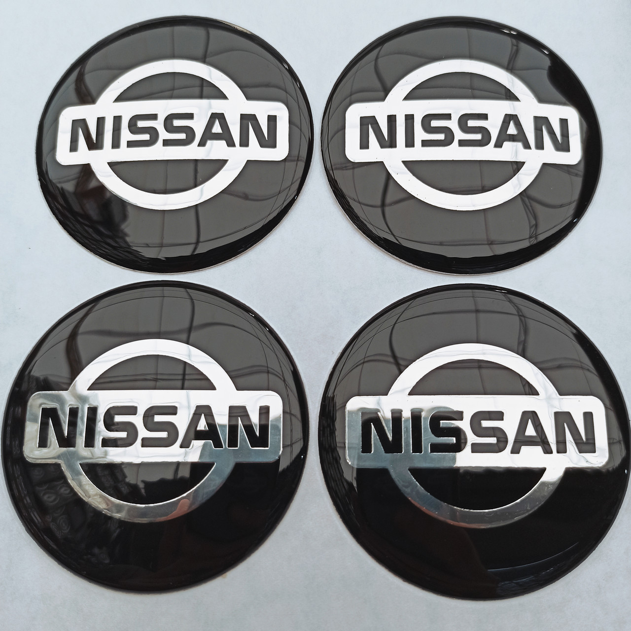 Наклейка опукла на ковпачок диска Nissan 65 мм чорна