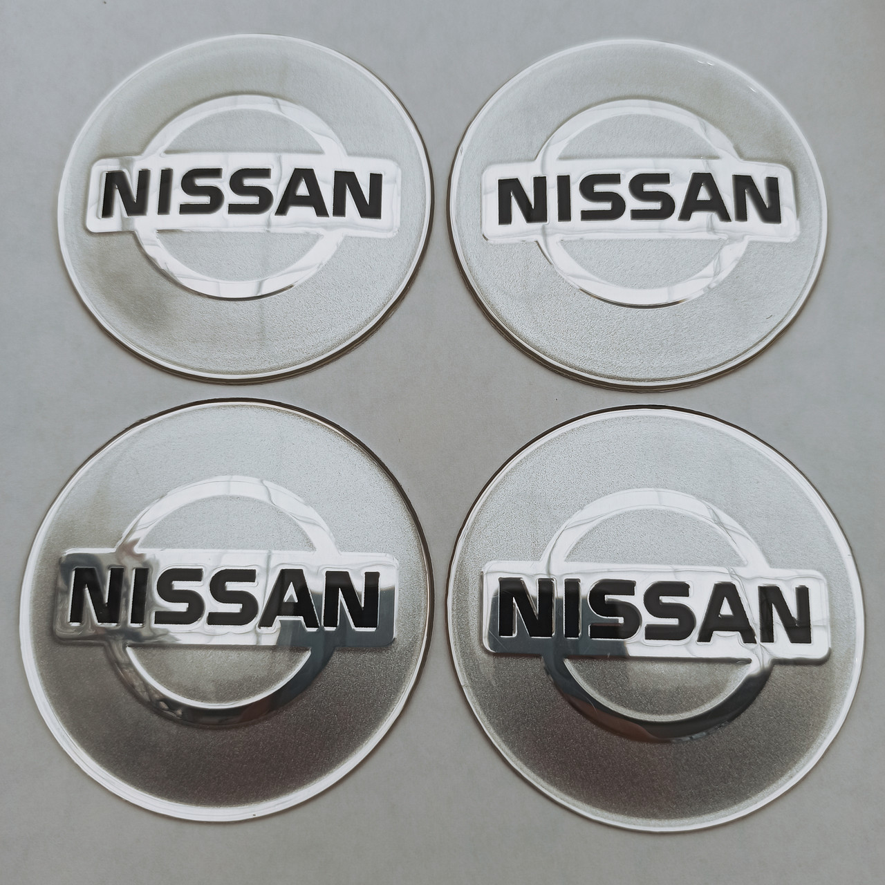 Наклейка опукла на ковпачок диска Nissan 65 мм