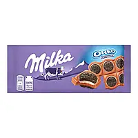 Шоколад Milka молочный с круглым печеньем Орео с начинкой со вкусом ванили 92 г