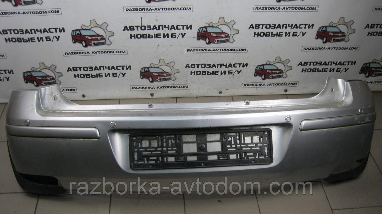 Бампер задній (металік-срібло) з парктроніками Opel Corsa C (2004-2012) OE:9317705