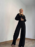 Женский костюм свободного кроя из фактурного трикотажа S, чорний