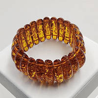 Браслет із синтетичного бурштину 35 мм 17 см на гумці колір бурштиновий