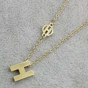 Жіночий кулон золотистого кольору на ланцюжку з неіржавкої сталі Stainless Steel розмір літери 9 х 12 мм