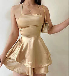 Бежевий жіночий коктейльний приталений шовковий міні-комбінезон плаття на бретелях зі шнурівкою по спині