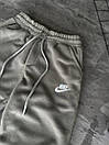 Спортивні штани чоловічі бежеві однотонні зимові на флісі фірмові Nike (Найк), фото 2