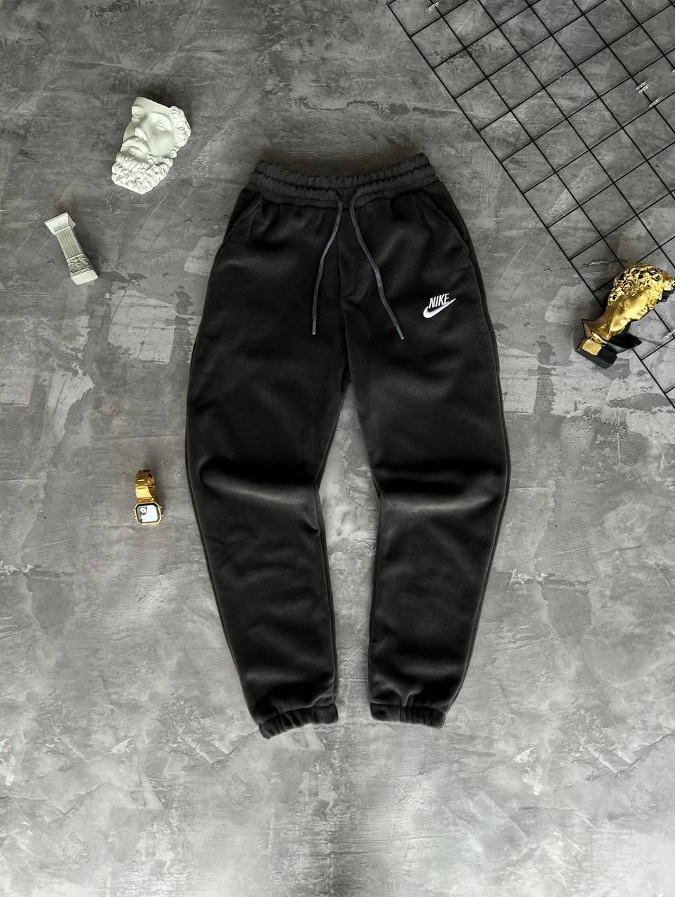 Спортивні штани чоловічі чорні однотонні зимові на флісі фірмові Nike (Найк)