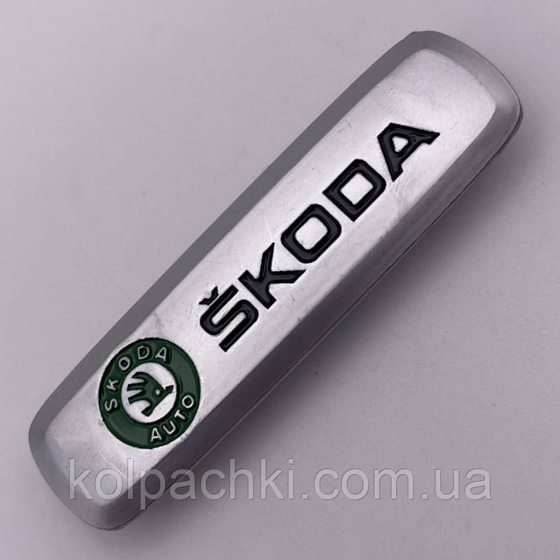 Шильдик на автокилимок Skoda шлунка