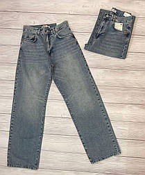 Жіночі широкі джинси вінтажного кольору з торочками внизу