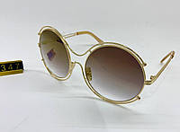 Женские солнцезащитные очки круглые оверсайз в двойной золотистой оправе металлической