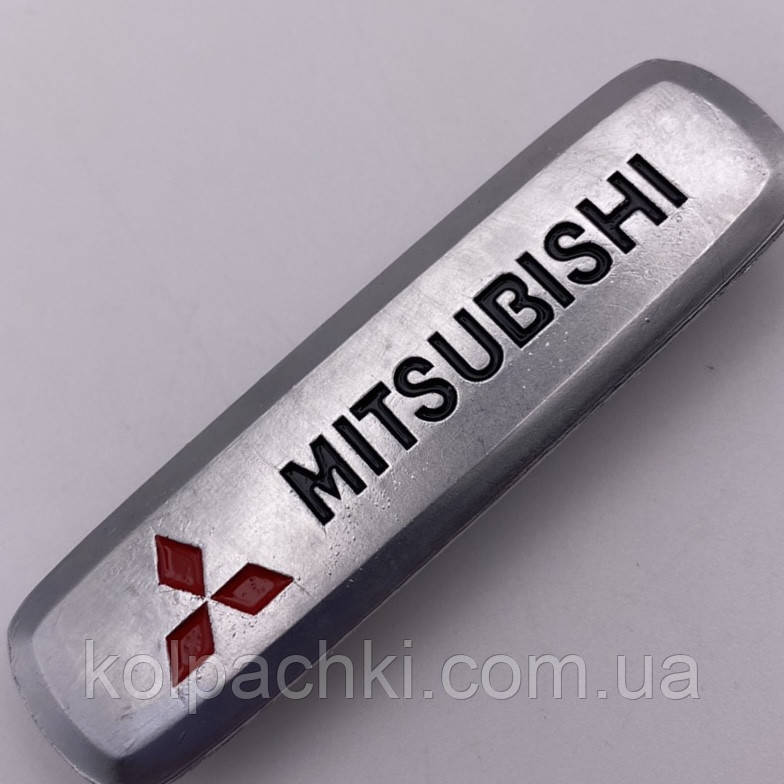 Шильдик на автокилимок міцубіші Mitsubishi Motors