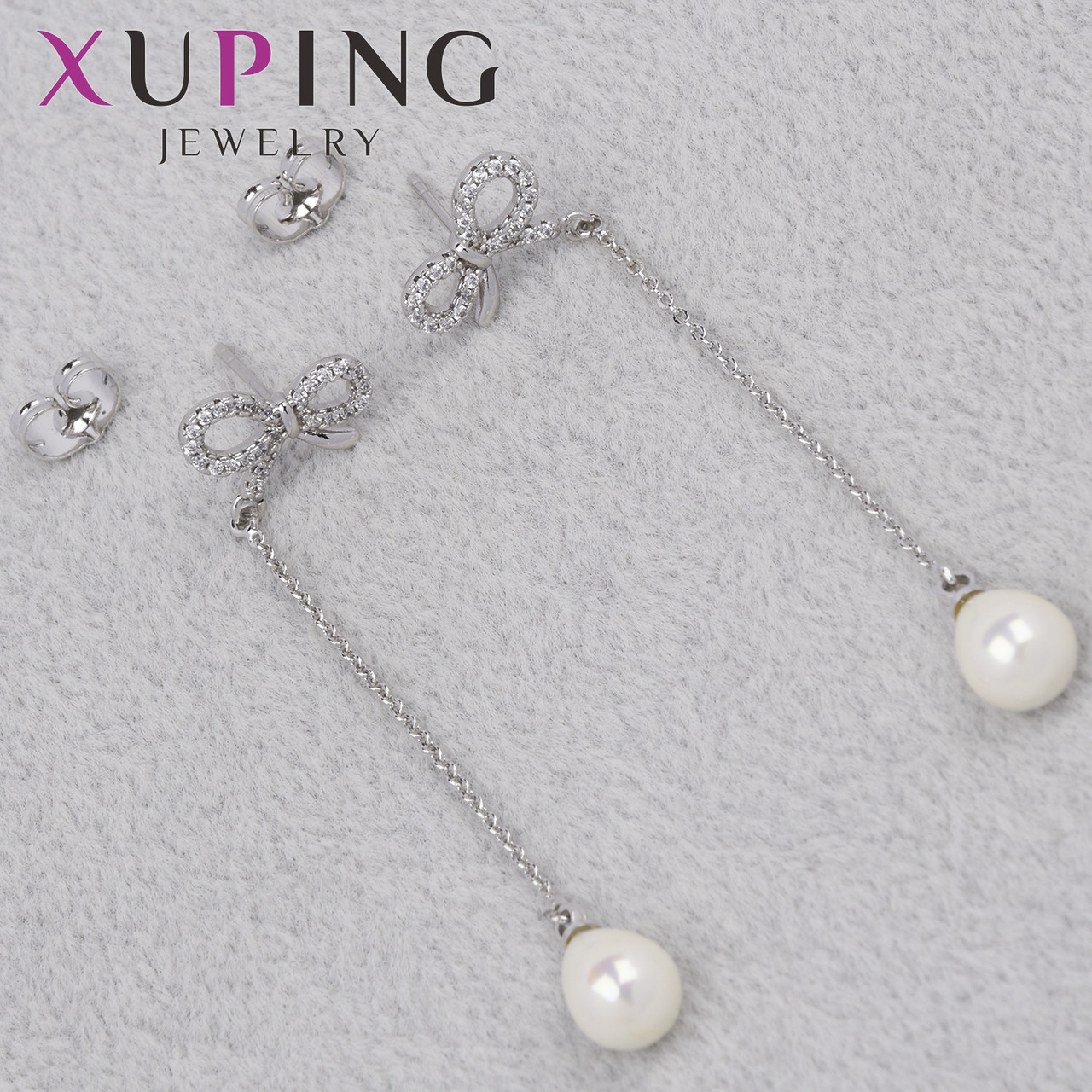Серьги пуссеты гвоздики серебристого цвета фирма Xuping Jewelry бантики с висюльками размер 13х70 мм