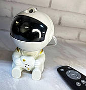 Нічник - проектор зоряного неба Астронавт Astronaut що сидить із зіркою космонавт з пультом 8 режимів
