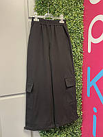Черные широкие брюки карго из плотной костюмной ткани и накладными карманами