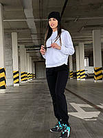 Женский черно-белый спортивный костюм их двунитки: кофта с карманом-кенгуру с капюшоном и штаны на манжетах