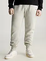 Оригинал | Мужские спортивные штаны джогеры на манжете Calvin Klein Jeans на флисе в бежевом цвете