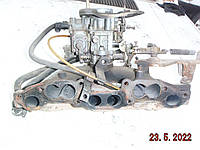 На VOLVO 340 - 345 1,4b (B14E) коллектор впускной/выпускной в чугуне на SOLEX