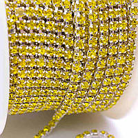 Декоративна стрічка ланцюжок зі стразами (за м). Ширина — 2 мм. Колір — жовтий
