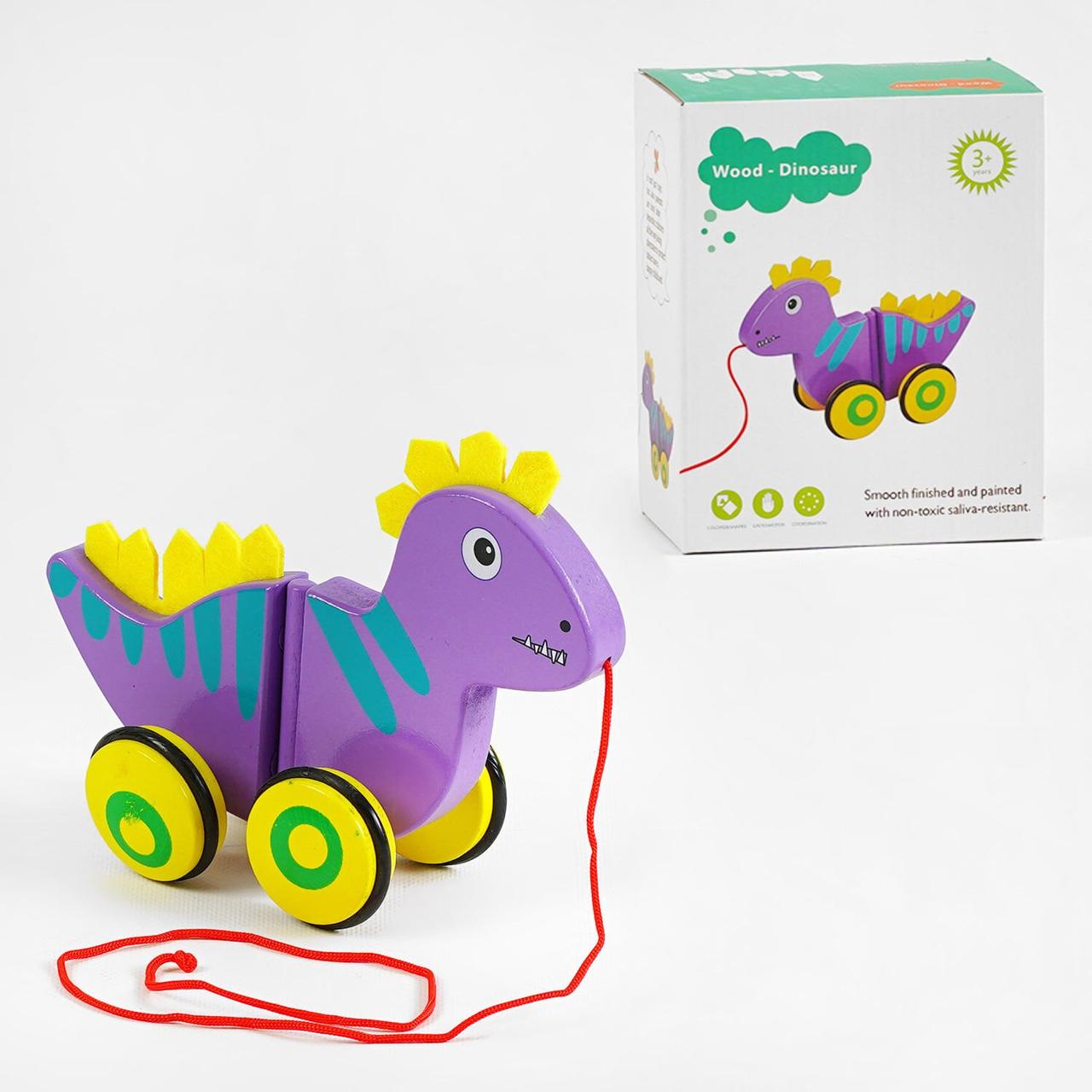Дерев`яна каталка C 63987 “Динозаврик”, виляє хвостом, фетрові шипи.