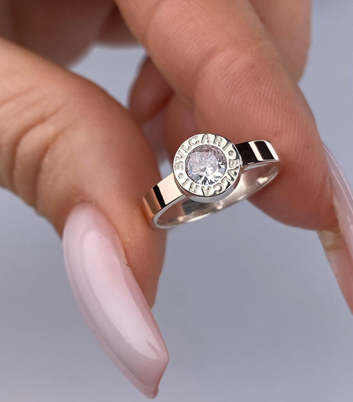 Срібна жіноча каблучка Bvlgari з золотими пластинами
