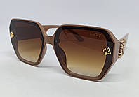 Loewe очки женские солнцезащитные коричнево бежевые с градиентом с золотым логотипом