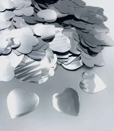 Конфеті сердечка срібного кольору 25мм., 100 гр./уп.
