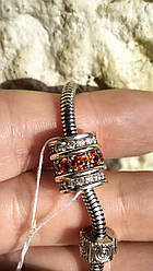 Срібний шарм з червоним камінням