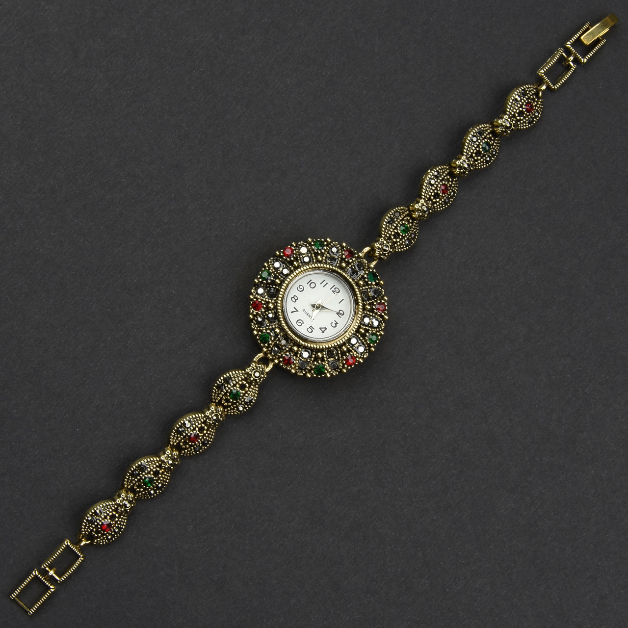 Женские часы винтажные круглые кварцевые металл в золотистом цвете с красными и зелёными стразами длина 19 см - фото 1 - id-p2104647839