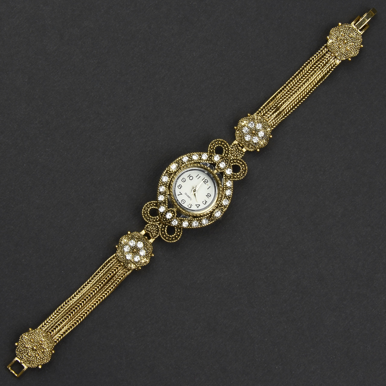 Женские часы винтажные круглые кварцевые бижутерный сплав металл в золотистом цвете с стразами длина 19 см - фото 1 - id-p2104653939