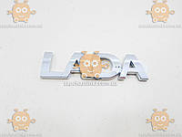 Эмблема задка "LADA" ВАЗ 1117, 1118, 1119, 2170-2172 ПРИОРА левый 84х22мм ХРОМ на скотче (орнамент) АТ 33020