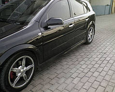 Бічні спідниці HB під фарбування для Opel Astra H 2004-2013рр