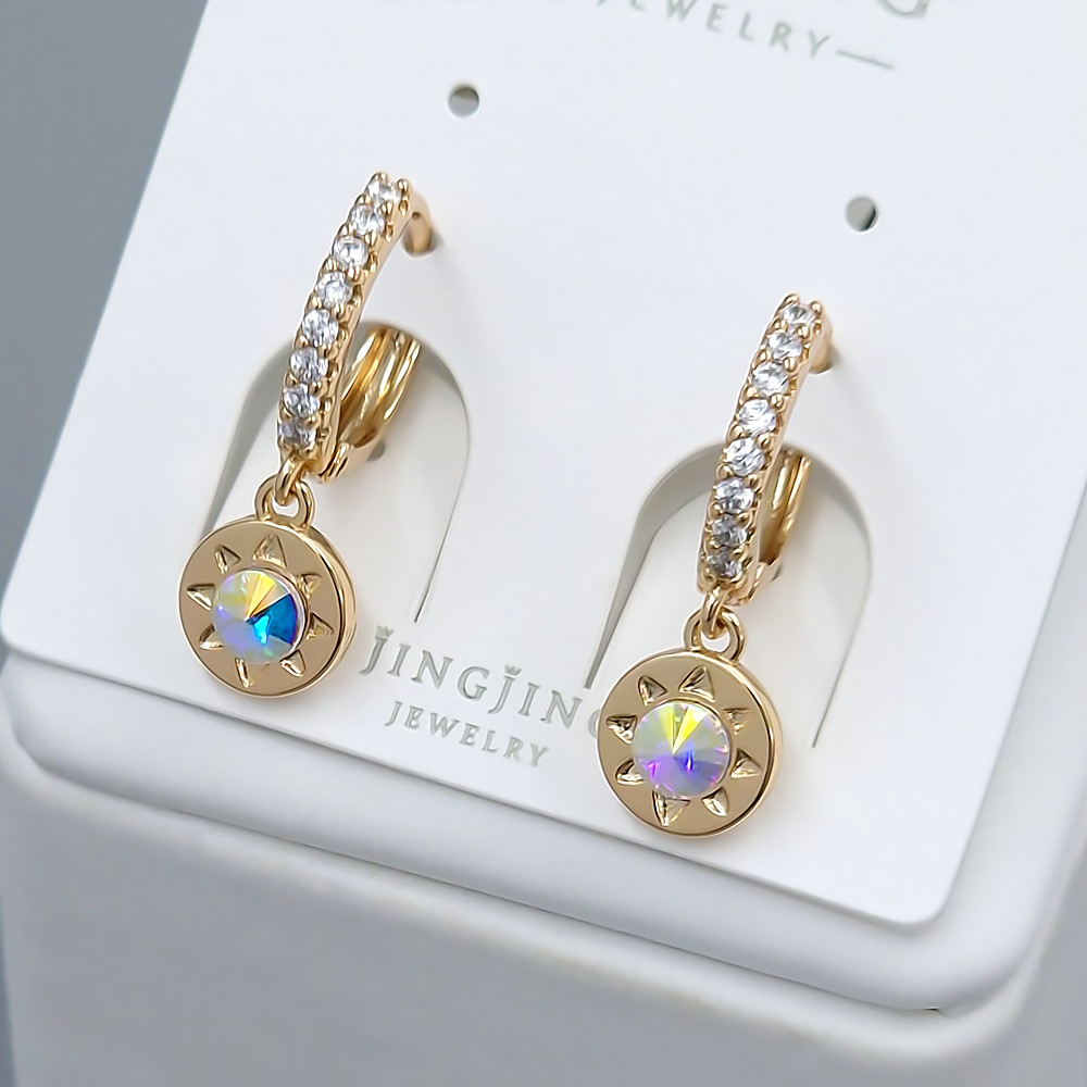 Сережки XР. Позолота 18К. Камені: Swarovski бензинового кольору та циркону Довжина: 21 мм Ширина: 8 мм Діаметр: 14 мм
