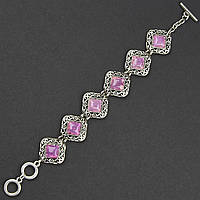 Браслет жіночий сріблястого кольору з візерунками та ліловими камінчиками чаровит тогл довжина 22 см ширина 23 мм