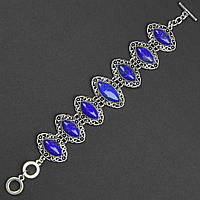 Браслет жіночий сріблястого кольору овальний з візерунками камінням лазурит застібка тогл довжина 22 см ширина 30 мм