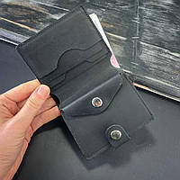 Компактне шкіряне портмоне на кнопці з монетницею чорного кольору із плотної шкіри