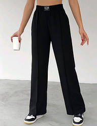 Молодіжні штани в чорному кольорі прямого пошиття з тканини лакоста S та L