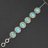 Браслет жіночий сріблястого кольору круглий із бірюзовими камінчиками застібка тогл завдовжки 22 см ширина 25 мм